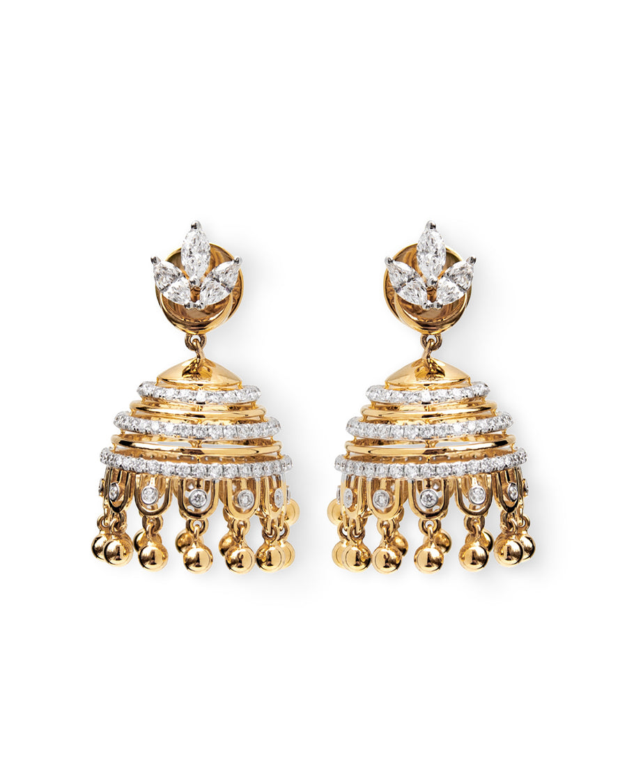 Gold and diamond earrings on a white background